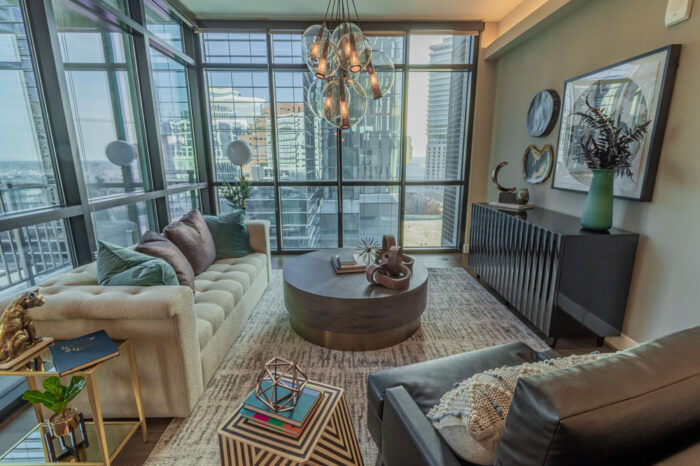 Living room with glass panels and couches