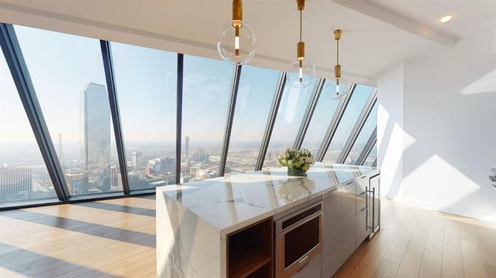 Kitchen island table facing a city view