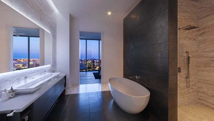 Bathroom with a white and brown walls with a large bathtub