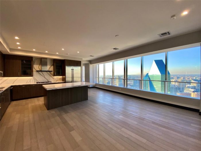 A large kitchen with brown flooring