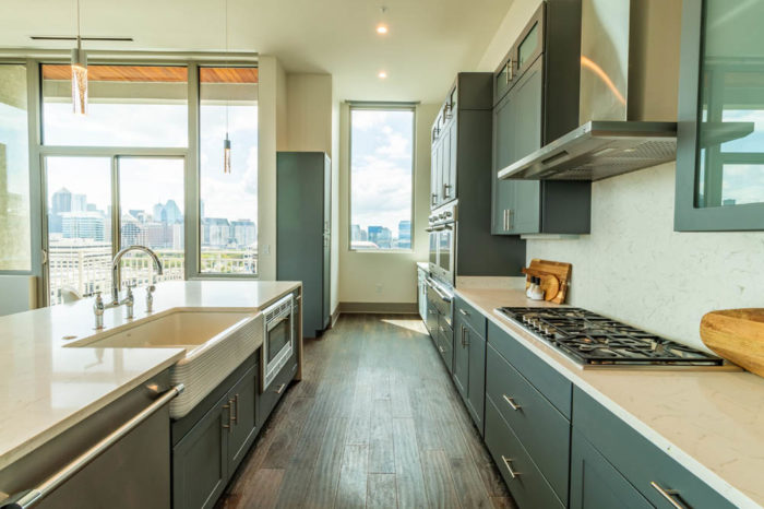 A convenient kitchen with sinks and burners