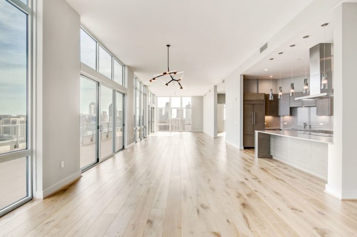 The Katy Victory Park Penthouse with large windows and hardwood floors.