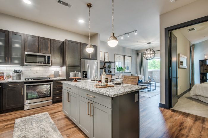 A fancy kitchen with lots of lights